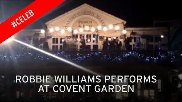 watch-robbie-williams-entertain-fans-with-surprise-concert-in-london-s