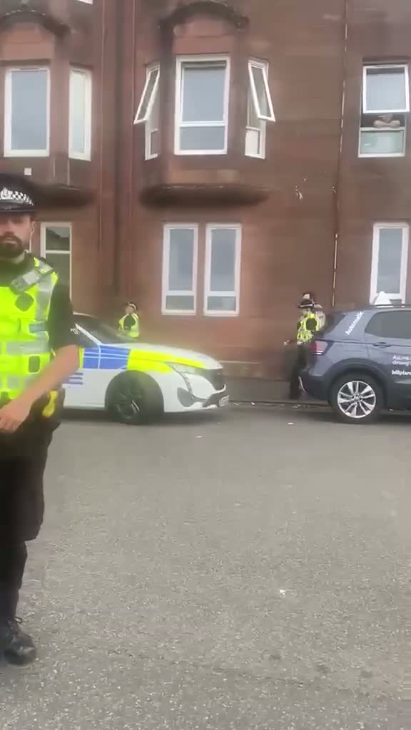 Ex-Tory staffer Kyle Thornton removed from home by police as mob chants 'beast out'