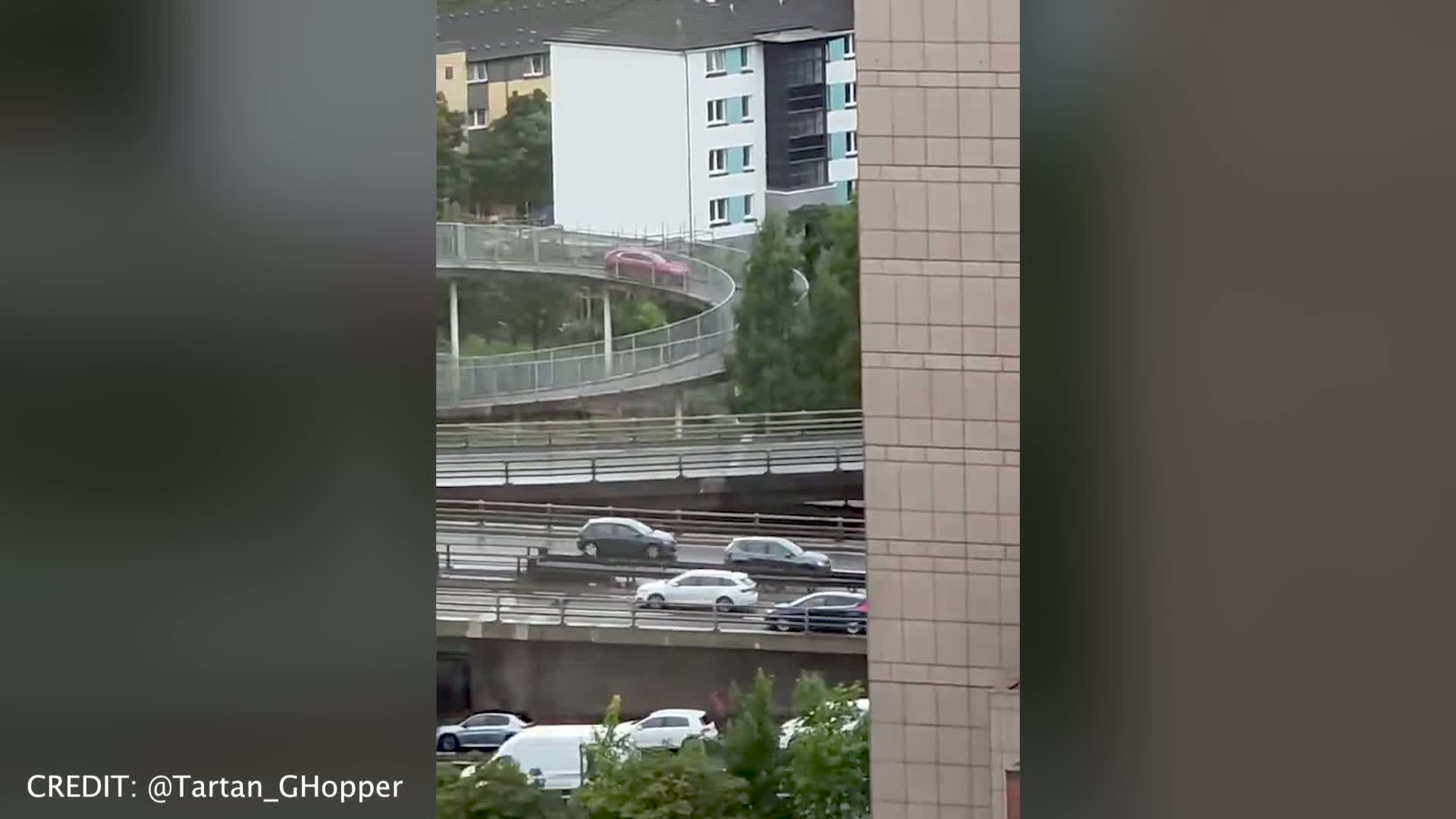 Car spotted driving down pedestrian bridge over Glasgow motorway