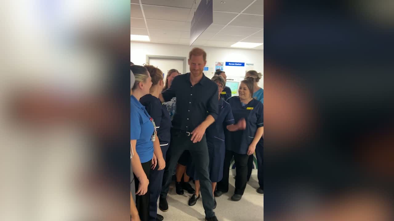 Prince Harry mobbed by nurses at Birmingham Children's Hospital, hugs staff